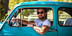 Man in sunglasses looking cool in a classic car